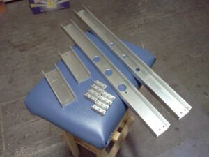 Frame members cut and drilled, ready for assembly.